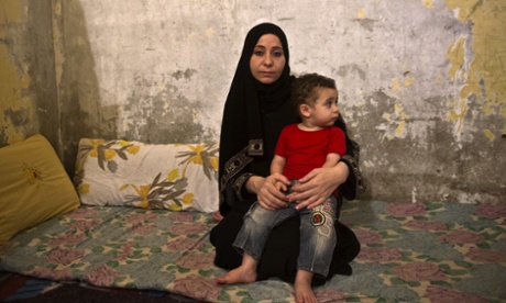 Syrian refugee Reem al-Sawaa with her son Khaled in the Egyptian capital of Cairo where the mood has changed towards Syrian refugees.