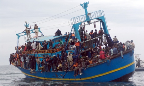 Migrants stranded on a boat coming from Libya wait for rescue off the Tunisian coast.