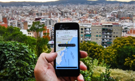 Uber app on phone overlooking San Francisco