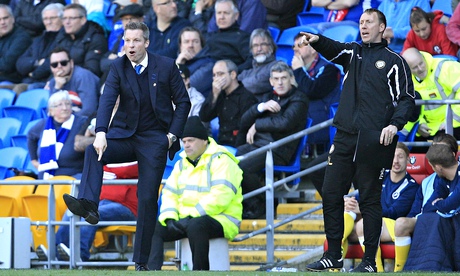 The Millwall manager Neil Harris, left, gestures during the 0-0 draw in the Championship at Cardiff