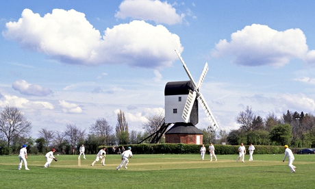 Cricket match with windmill in background
