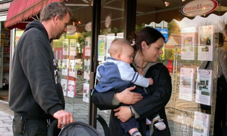 A couple looks at homes to buy.