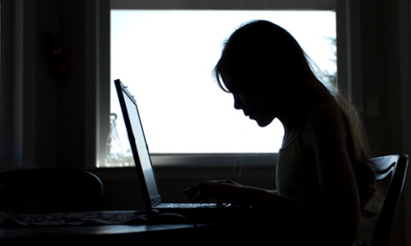 A child using a laptop at home. 