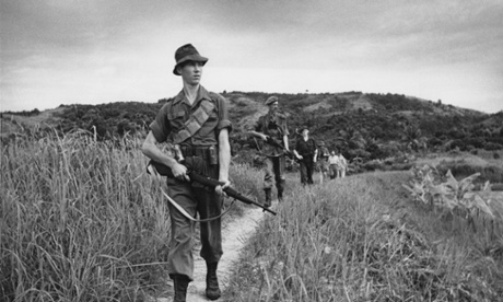 Scots Guards patrol an area of jungle in Malaya in 1950. British troops were there to fight communist insurgents of the Malayan National Liberation Army in what was then a UK protectorate.