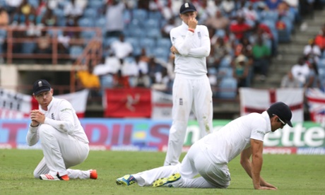 England's Alastair Cook looks dejected after dropping a catch to dismiss Marlon Samuels off the bowling of Chris Jordan.