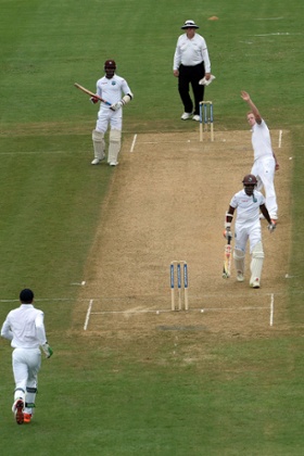 Ben Stokes celebrates dismissing West Indies batsman Shiv Chanderpaul, right