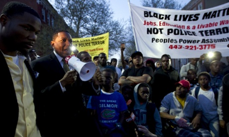 Maryland state delegate Keith E Haynes, speaks to the crowd outside of the Baltimore West District police station during a rally for Freddie Gray on Tuesday night.