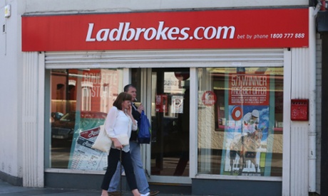 Ladbrokes restructures as earnings fall.