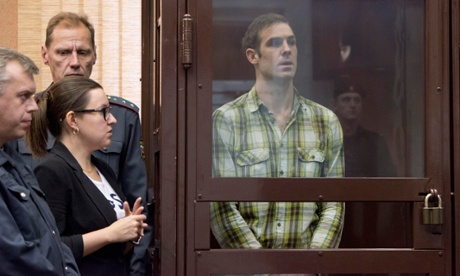 Briton Kieron Bryan (R), a Greenpeace International commissioned freelance videographer, attends a bail hearing at the Regional Court of Murmansk October 11, 2013.