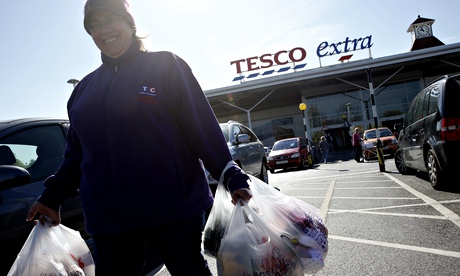 A woman shops at a Tesco supermarket