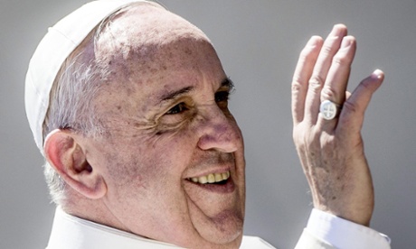 Pope Francis greets pilgrims and tourists iin St Peter's Square, Vatican City, for his weekly  general audience on 22 April. 