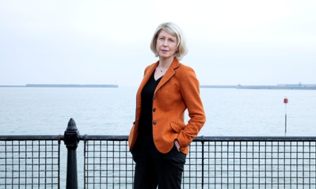 ‘I always feel better when I put this on’: Sarah Smith in her ‘Lib Dem orange’ jacket by the sea at Dover.