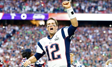 New England Patriots quarterback Tom Brady reacts as he takes the field before Super Bowl XLIX against the Seattle Seahawks at University of Phoenix Stadium.
