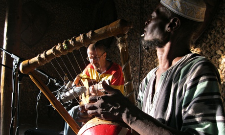 Birds and a lyre … Ayub Ogada (right)