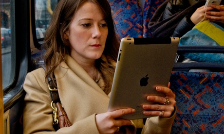 A woman reading a kindle