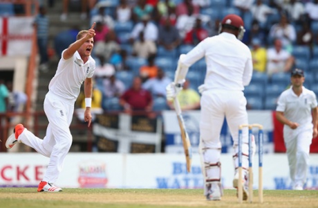 Stuart Broad celebrates taking the wicket of Denesh Ramdin.
