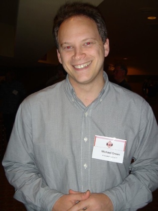 Grant Shapps wears a Michael Green name badge.