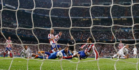 Javier Hernandez, right, sweeps the ball home to give Real the lead in the dying stages ...