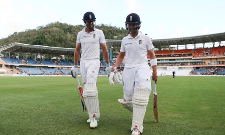 England's Alastair Cook and Jonathan Trott look pretty pleased with their performance as walk off at the end of the day's play.