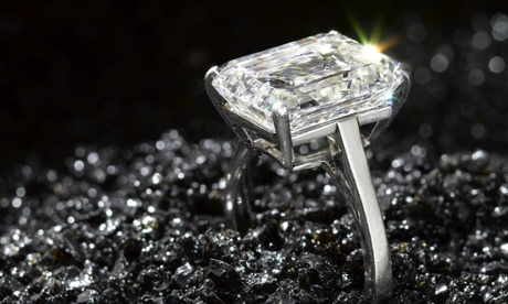 An emerald-cut diamond single-stone ring by De Beers, weighing 11.05 carats.