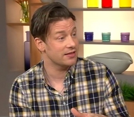 Jamie Oliver's new hair does a TV interview.