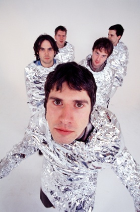 The band, who have dressed as yetis, wearing silver foil in 2001.