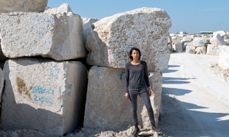 Artist Katrina Palmer amid the huge blocks of stone on Portland, part of her walking tour with audio commentary.
