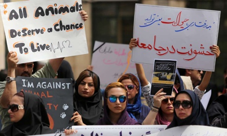 A group of Iranians staging a protest in Shiraz at the killings of stray dogs.