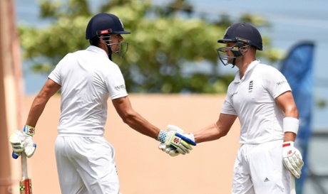 Alastair Cook is congratulated by Jonathan Trott after reaching fifty and their century partnership.
