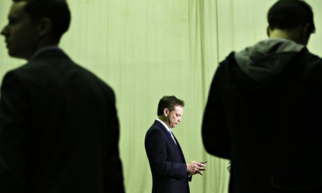 Grant Shapps using mobile device