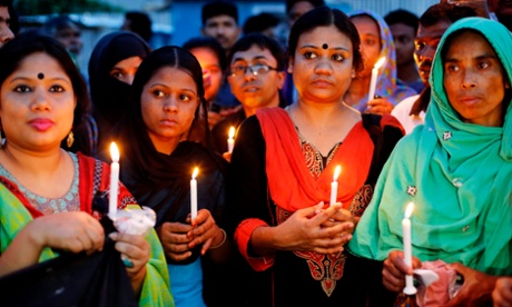 Relatives and activists attend a candlelight vigil 