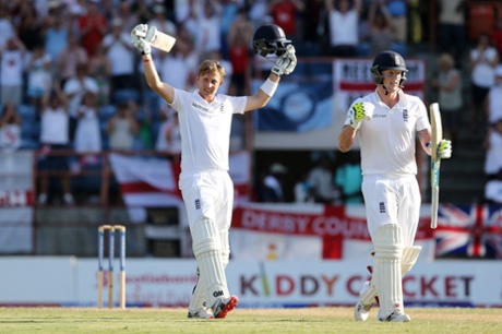 Joe Root celebrates his sublime century with Ben Stokes.