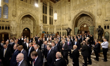 MPs walk through the members' lobby.