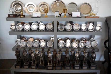 Some of McCoy's trophies displayed at his home, including horseshoes of every Grade One winner for owner JP McManus (middle), the MBE and OBE, two Cheltenham Gold Cups and the 'Lester's' (bottom), given for jockey of the year.