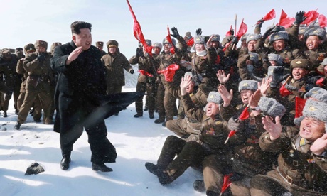 Kim Jong-Un waves to cheering Korean People's Army pilots on Mount Paektu.