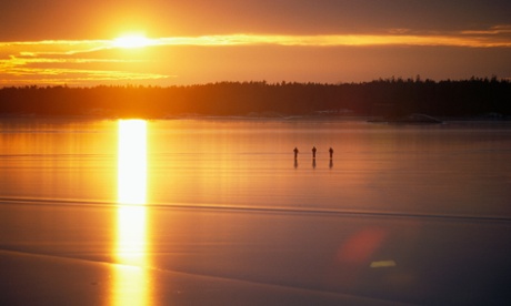 three people skating at sunset sweden