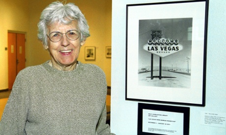 Betty Willis with a photograph of her sign.