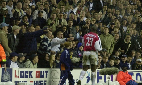 Campbell is abused by Spurs fans at an Arsenal-Spurs match.
