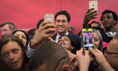 Ed Miliband poses for photos with supporters.