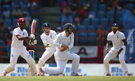 Kraigg Brathwaite pulls a delivery from Moeen Ali,  Gary Ballance takes evasive action.