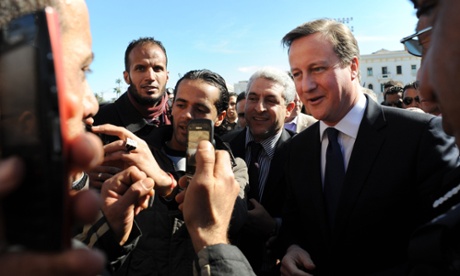 David Cameron walking through Martyrs square in Tripoli, Libya, in January 2013. Ed Miliband has said Cameron ‘bears some responsibility’ for the stream of refugees fleeing to Europe from Libya.
