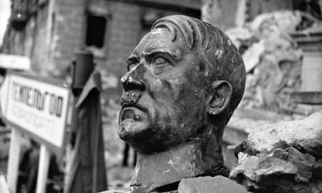 A bust of Adolf Hitler lies amid the ruins of the Reich Chancellery in 1945.