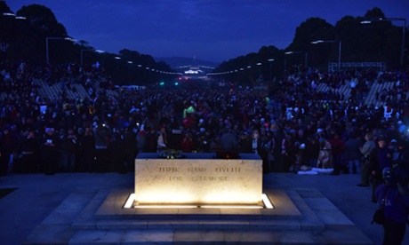 People look on during the dawn service at the Australian War Memorial in Canberra.