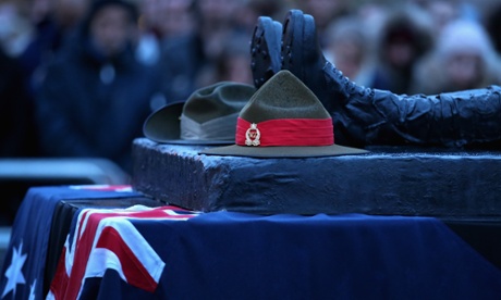 Australin and New Zealand army hats placed on a memorial at the Wellington Arch in London for Anzac Day.