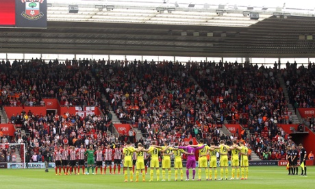 Players and fans observe a minute's silence for victims of the 1985 Bradford City fire.