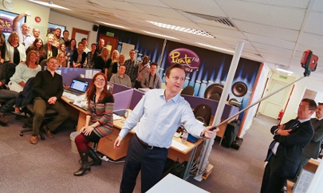 David Cameron uses a selfie stick on a visit to thhe Cornish radio Pirate FM offices.