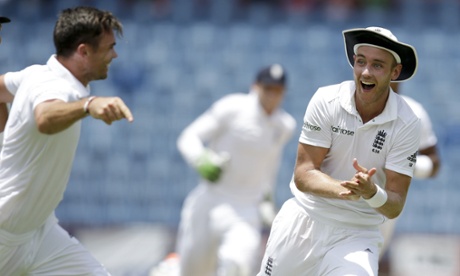 Stuart Broad bowler James Anderson, left, celebrates the dismissal of West Indies' Jason Holder with team-mate Stuart Broad.