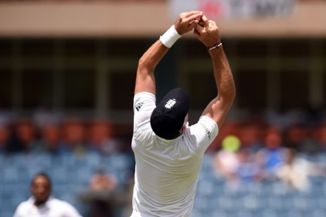 England's cricketer James Anderson catches to dismiss West Indies batsman Jermaine Blackwood.