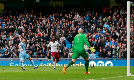 Sergio Aguero pounces on Brad Guzan's mistake to give the home side the lead.