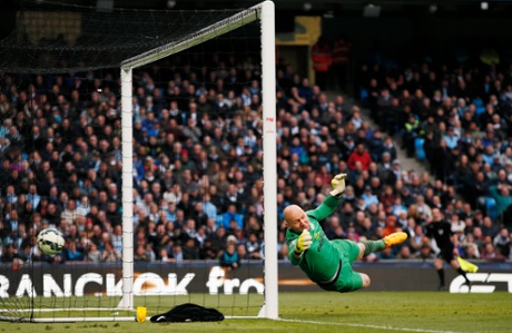 The ball finds a way through the wall and past Guzan to make it 2-0